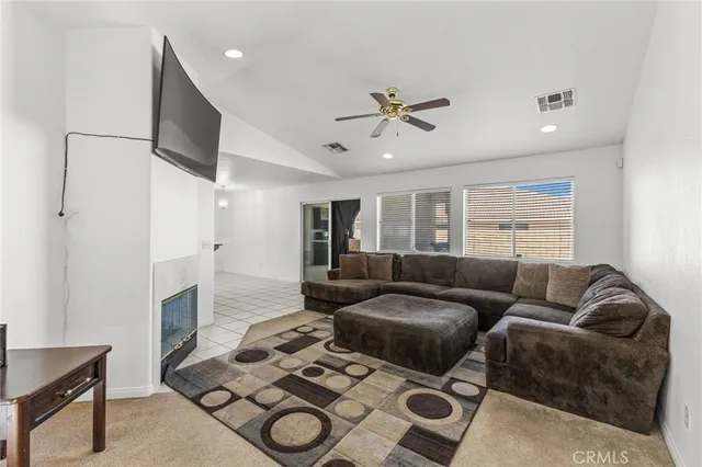 a living room with furniture and a rug