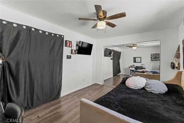 a bedroom with bed and a window