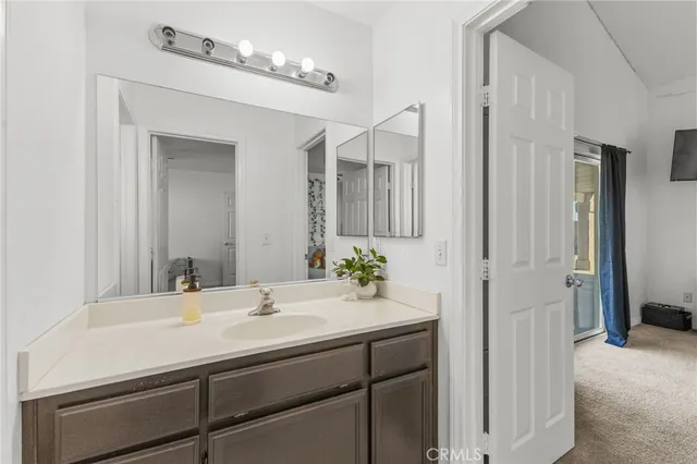 a view of a house with swimming pool and sitting area