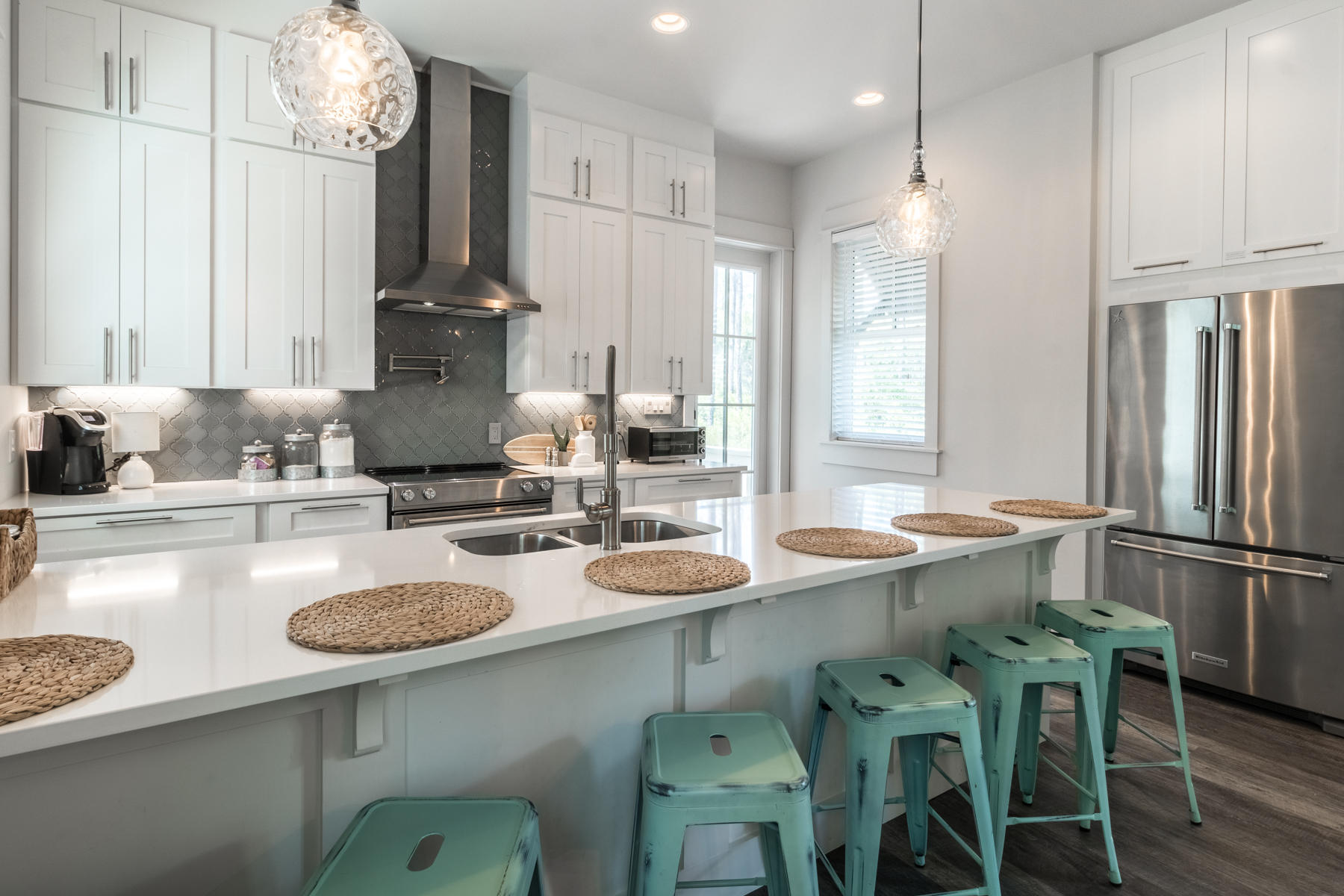 281 Redbud Ln Inlet Beach Inlet Beach, FL 32461 - Photo 15 of 34 a kitchen with a sink a counter and chairs