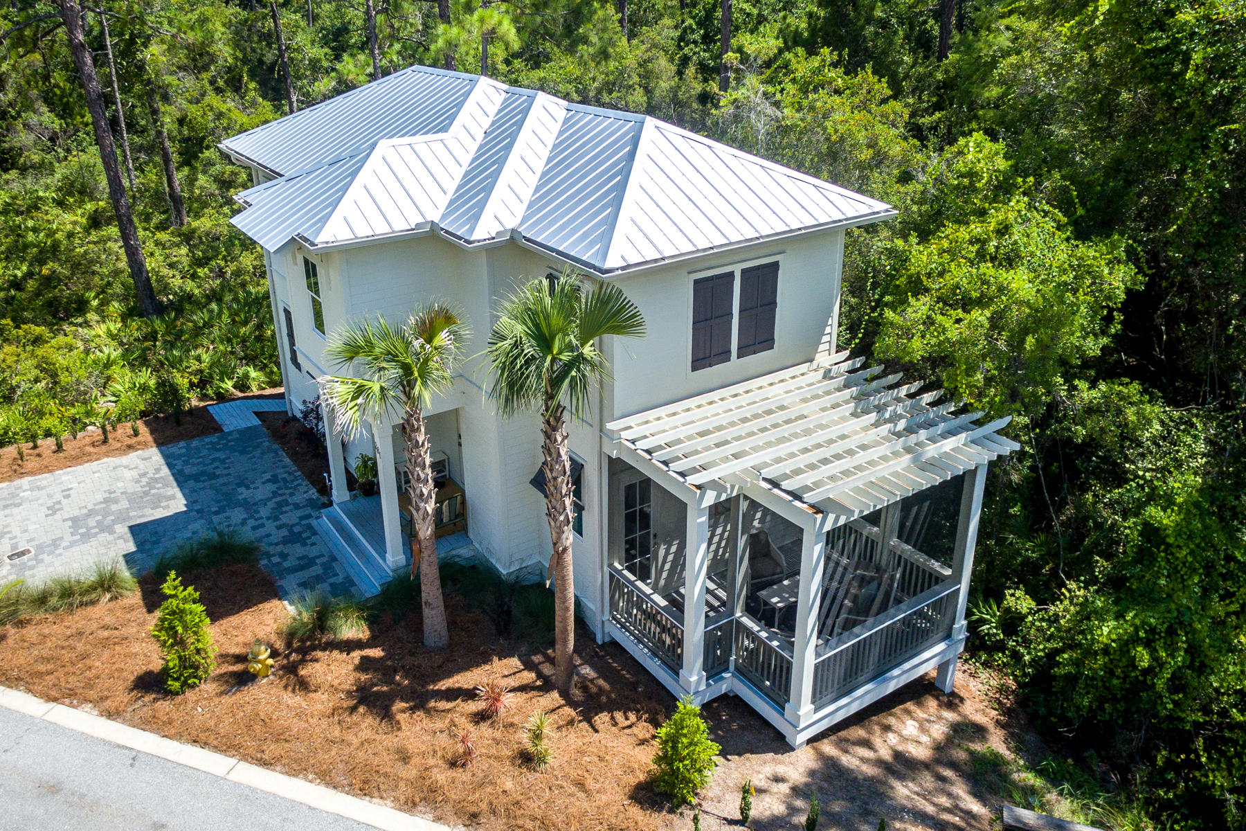 281 Redbud Ln Inlet Beach Inlet Beach, FL 32461 - Photo 24 of 34 a view of a house with a yard and potted plants