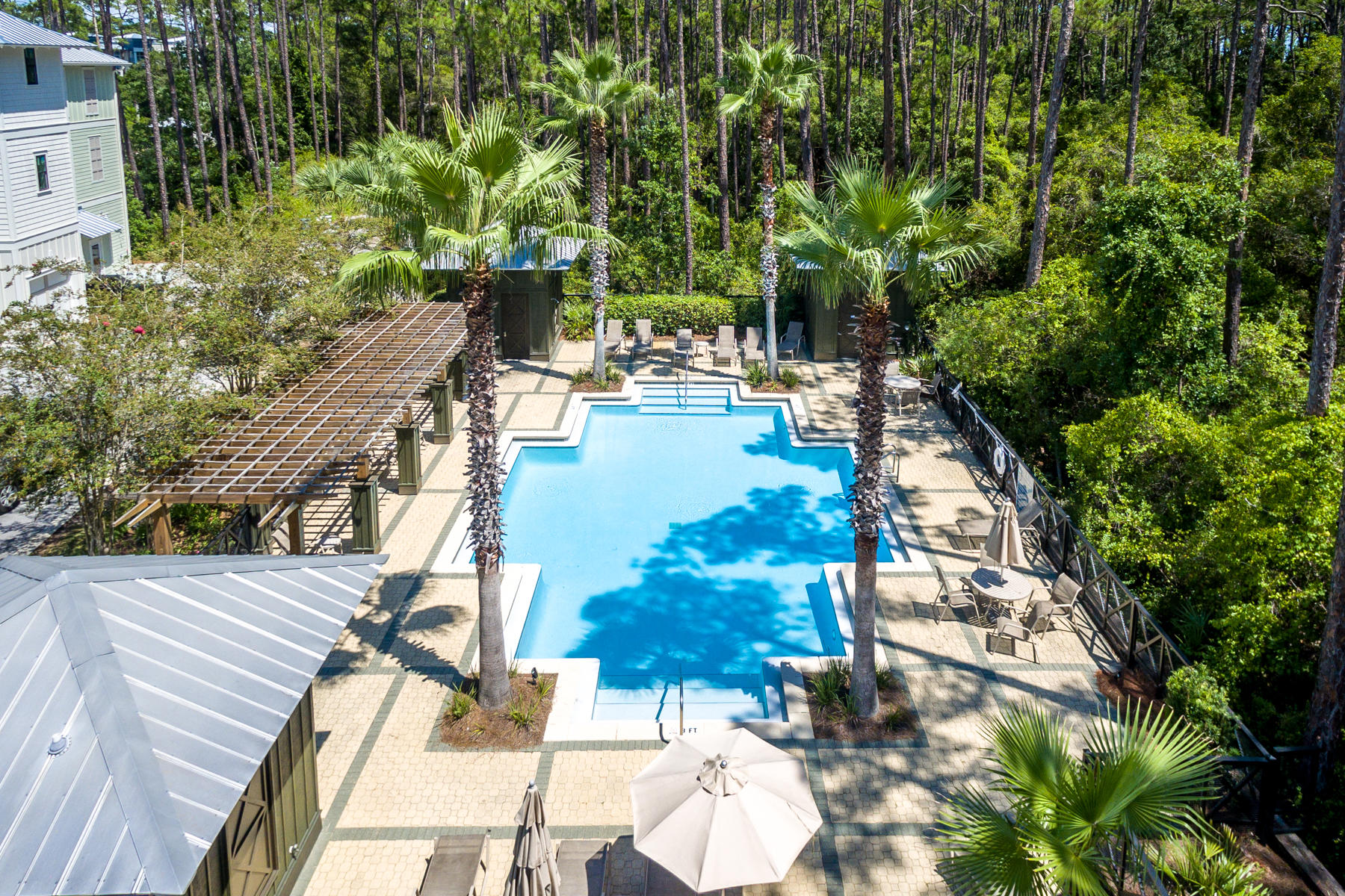 281 Redbud Ln Inlet Beach Inlet Beach, FL 32461 - Photo 27 of 34 a view of swimming pool with lawn chairs and plants
