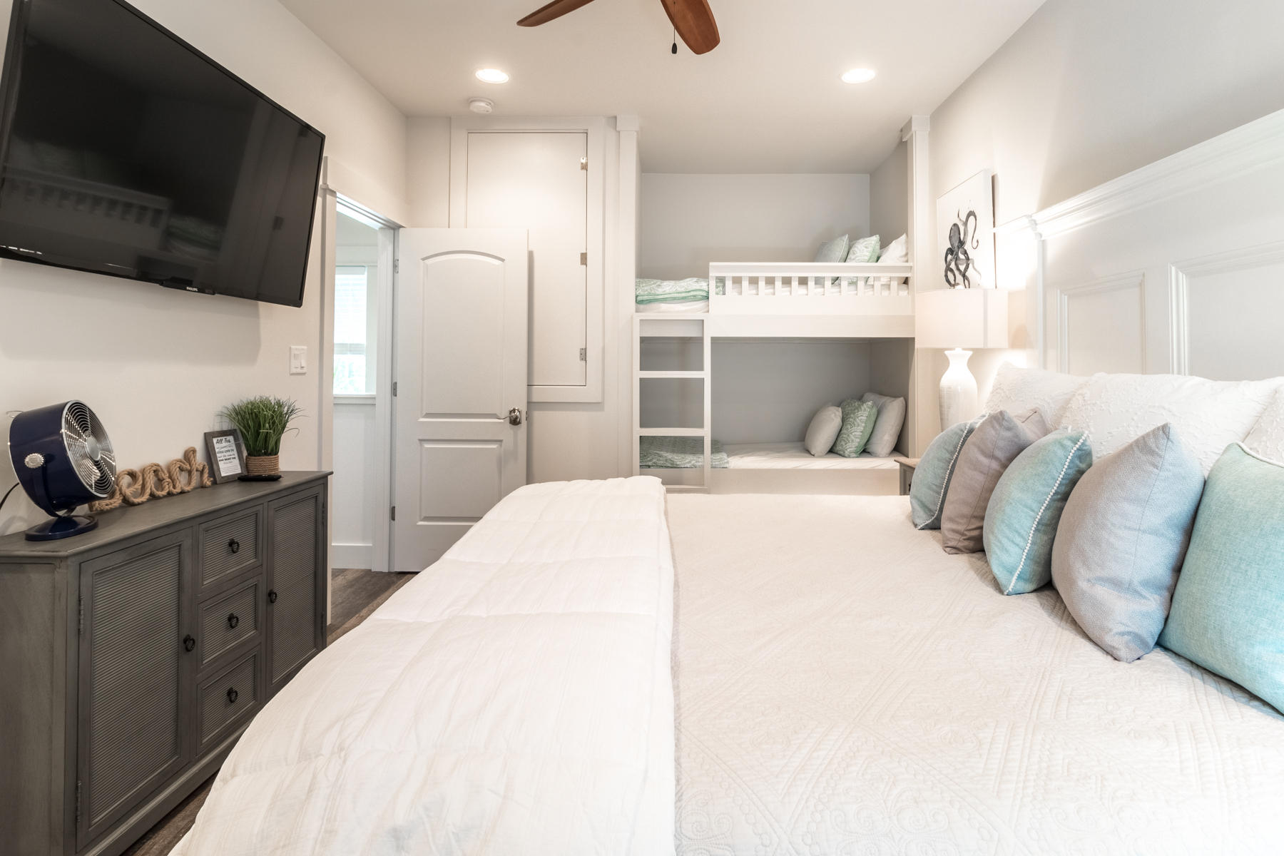 281 Redbud Ln Inlet Beach Inlet Beach, FL 32461 - Photo 10 of 34 a bedroom with a bed a flat screen tv and kitchen view