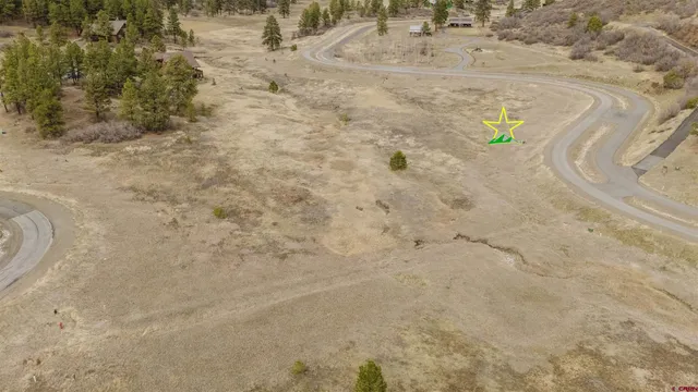 a view of a dry yard with mountain