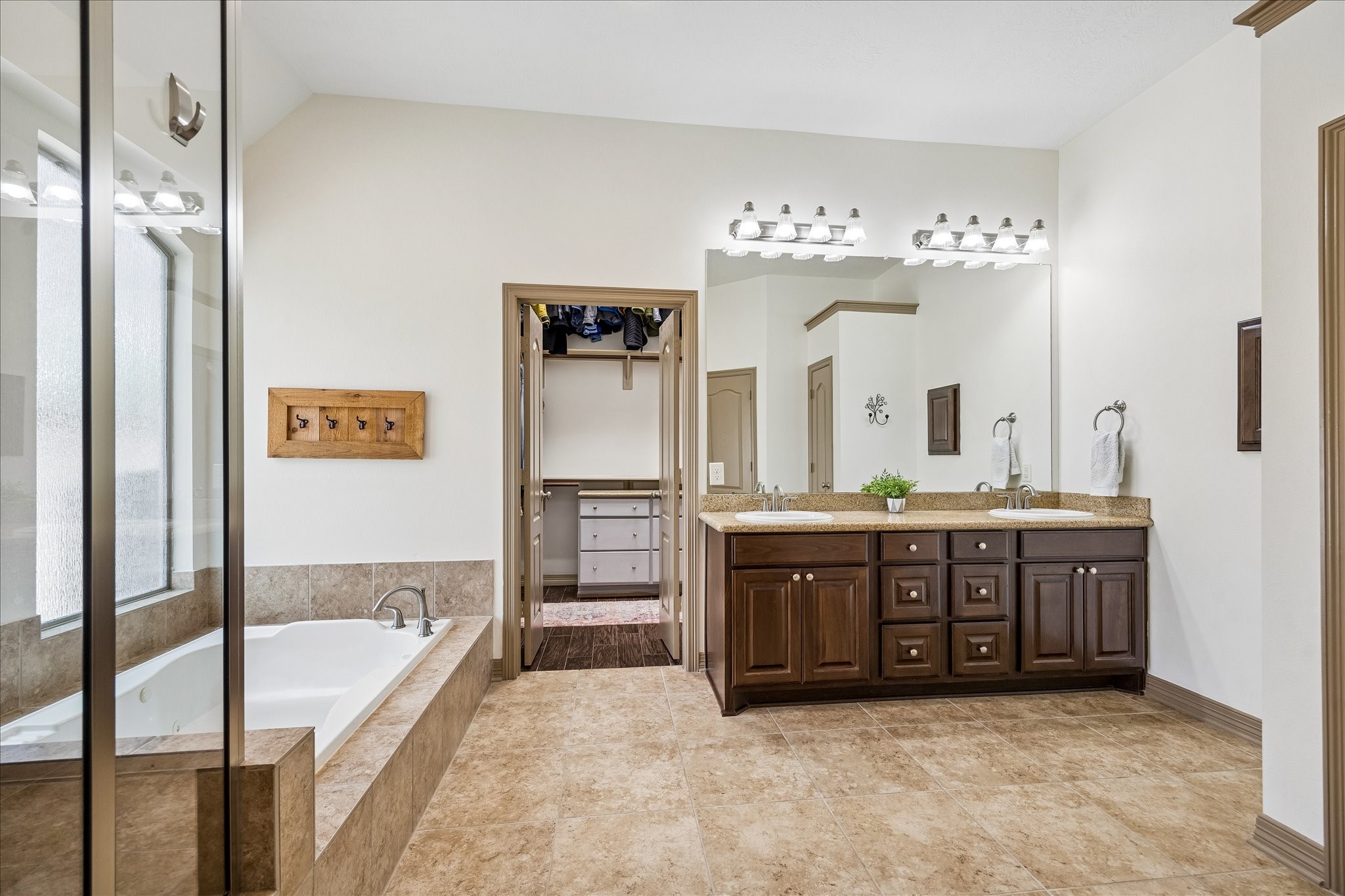 28211 Rippling Brook Lane Fulshear, TX 77441 - Photo 19 of 45 a spacious bathroom with a tub sink and mirror