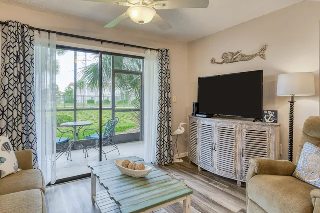 a porch with a table and chairs