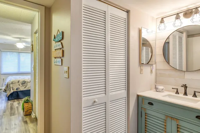 a view of a street with cars parked in front of it