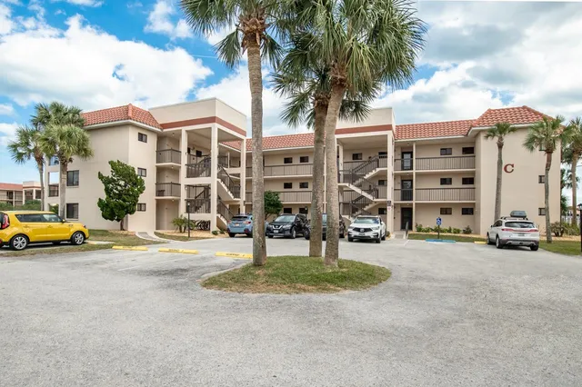 a view of a building with a yard
