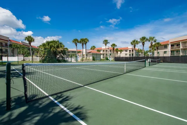 a view of swimming pool with outdoor seating and flat screen tv