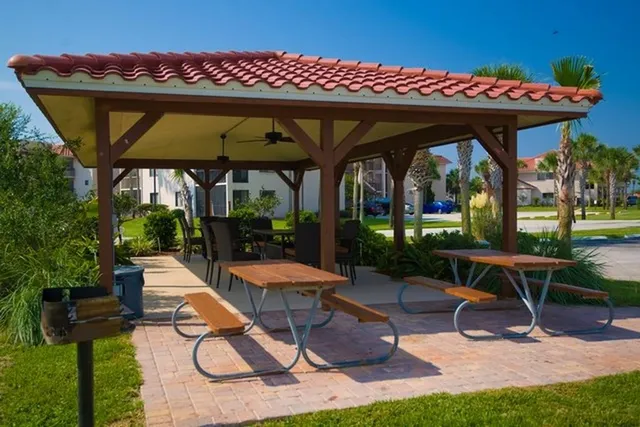 a view of a park with large trees