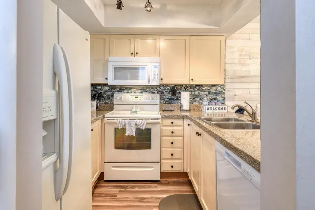 a kitchen with a sink and a microwave