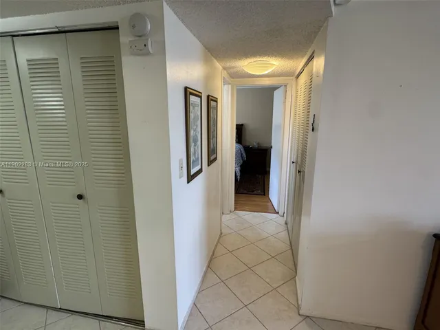 a view of a hallway with a room