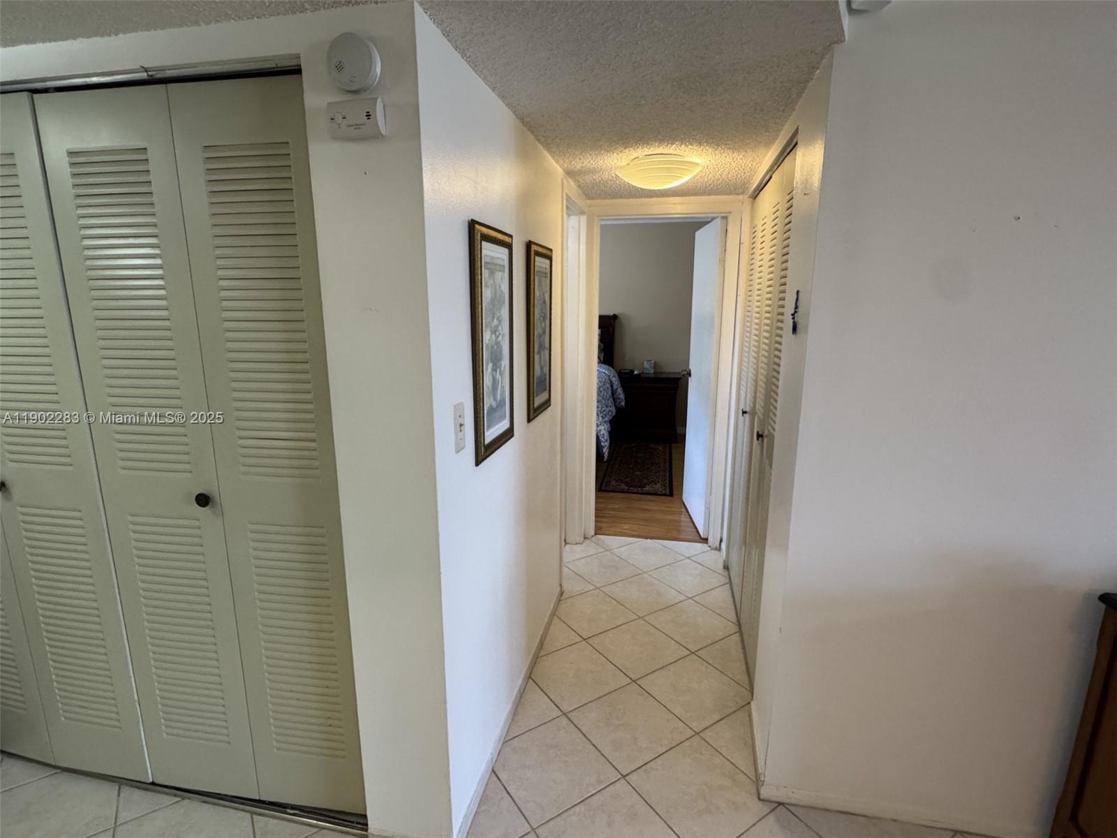 8330 Sands Point Boulevard, Unit N208 Tamarac, FL 33321 - Photo 11 of 35 a view of a hallway with a room