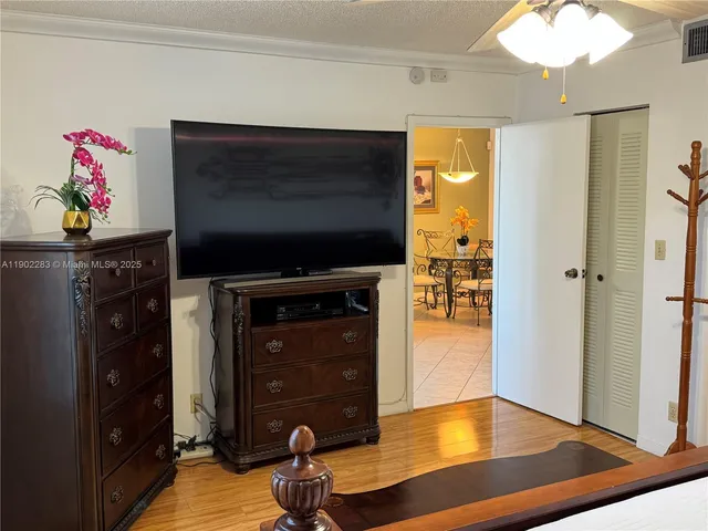 a living room with furniture flat screen tv and a fireplace