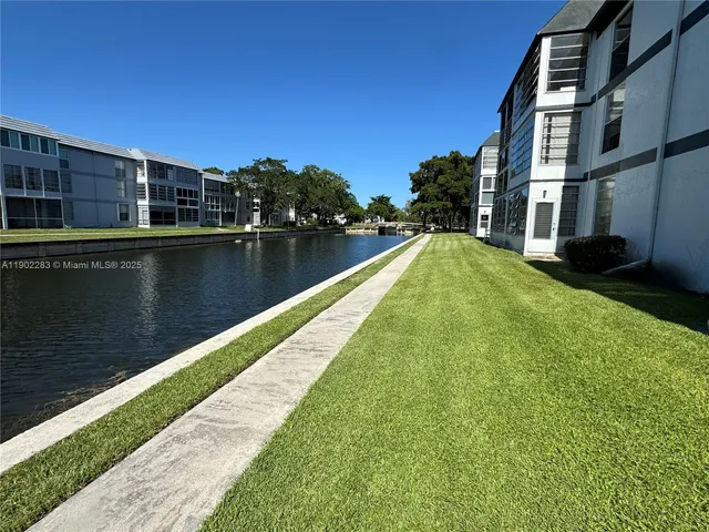 a view of swimming pool with a yard