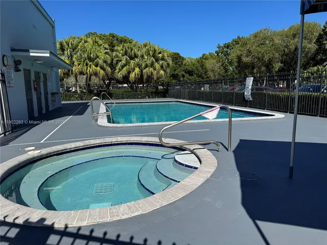 a view of a swimming pool with a backyard