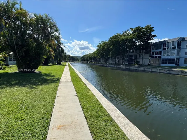 a view of a lake with a garden