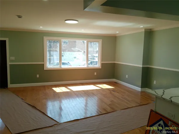 a room with a bed and a window