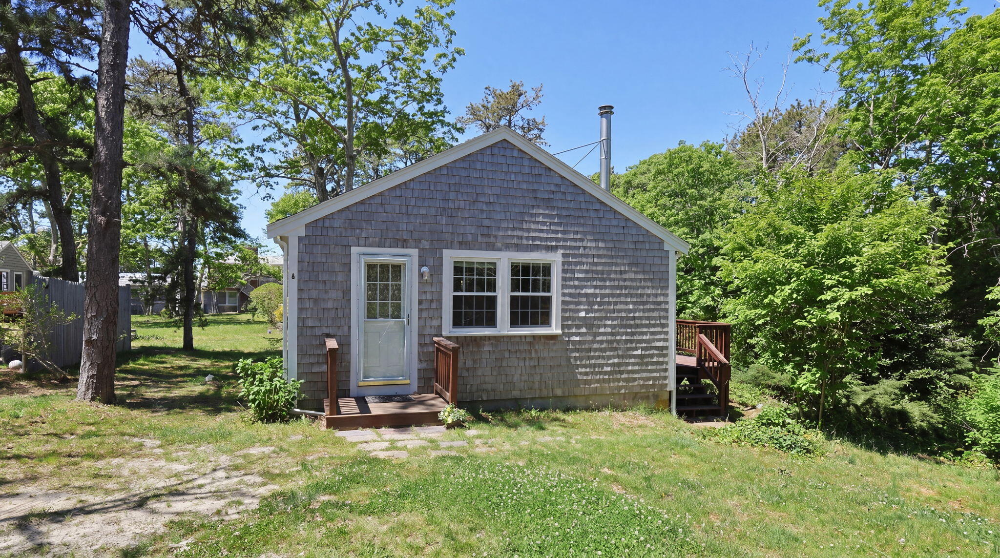 60 Long Avenue, Unit A Wellfleet, MA 02667 - Photo 1 of 28 front view of a house with a yard