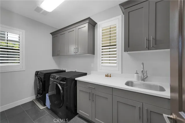 a bathroom with a sink and mirror