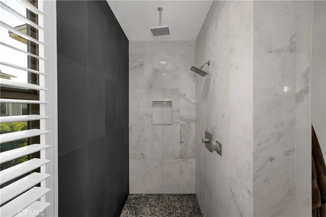 a bathroom with a granite countertop sink a toilet and a mirror