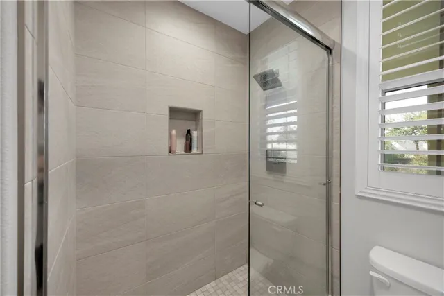 a living room with furniture rug and window