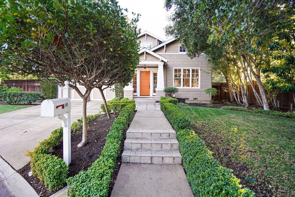 front view of a house with a yard