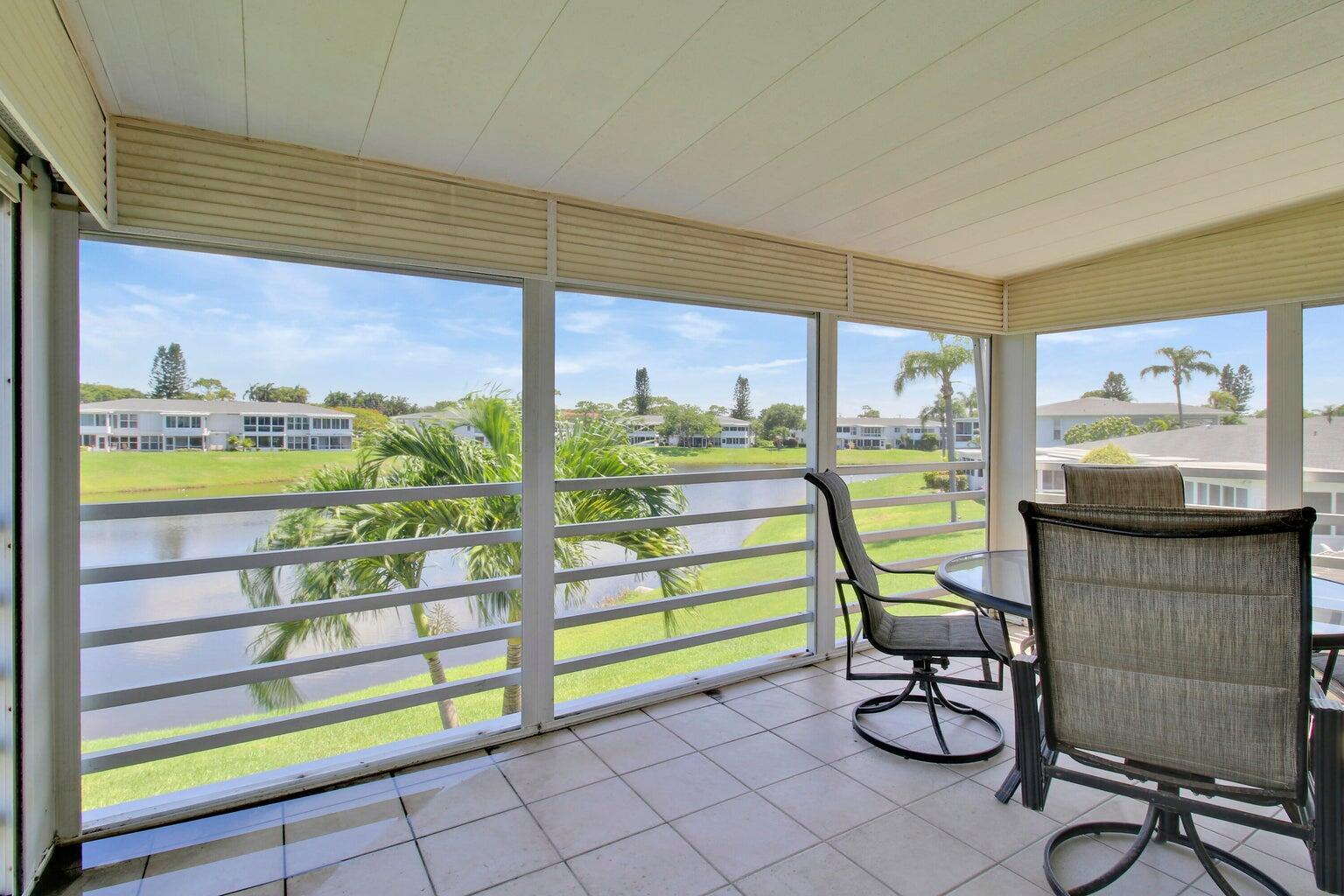 a view of a chair and tables in the patio