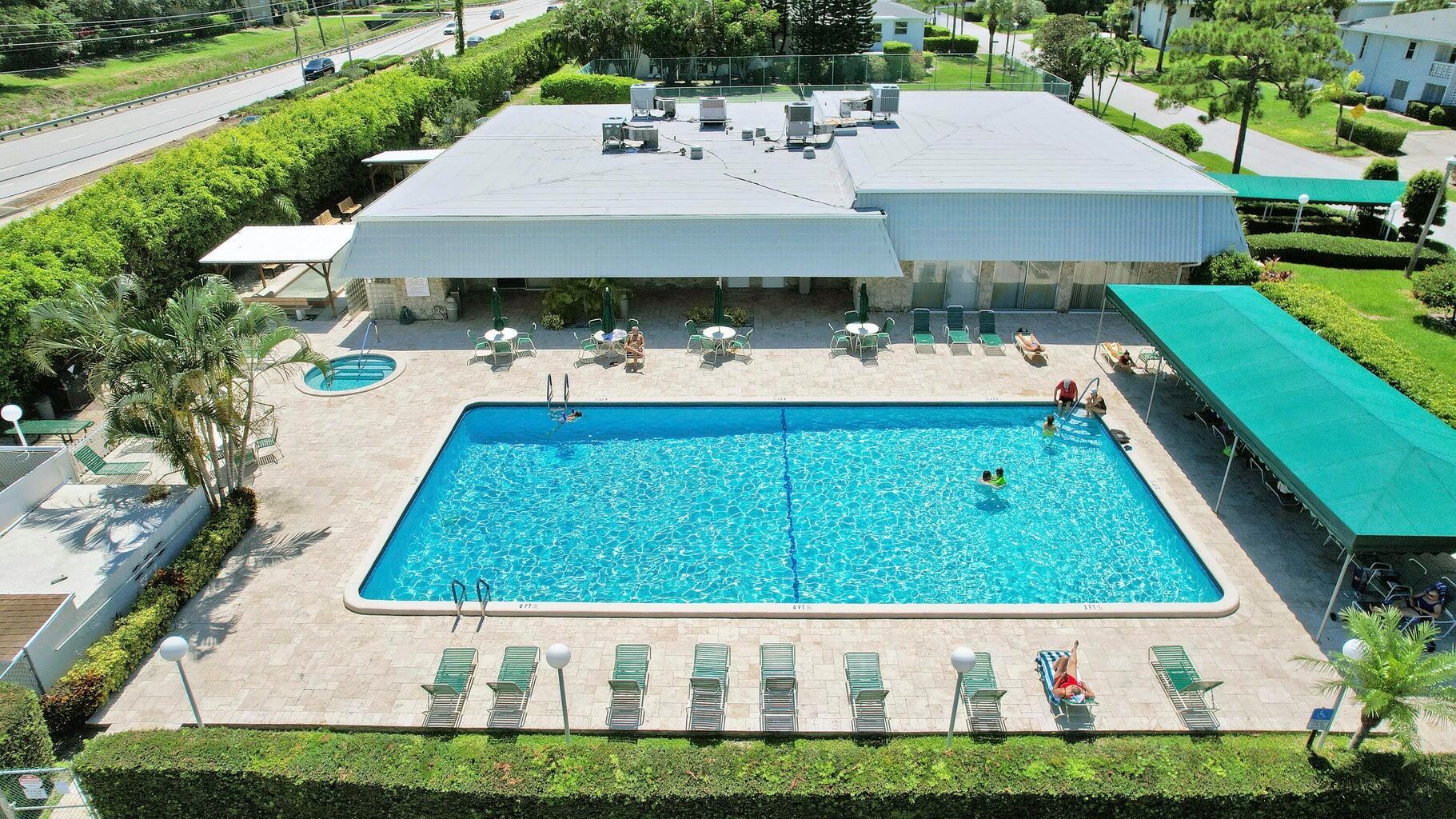 2730 Southwest 13th Street, Unit 203 Delray Beach, FL 33445 - Photo 22 of 23 a view of a back yard of the house