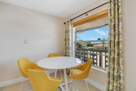 a blue chair sitting in front of a window