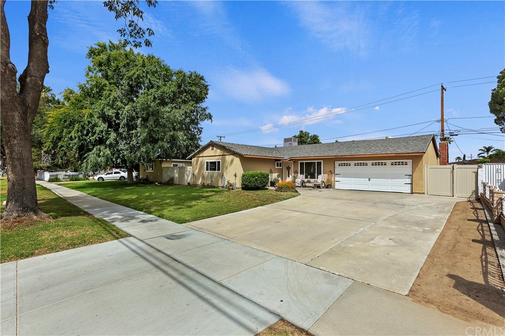 8761 Colorado Avenue Riverside, CA 92503 - Photo 1 of 1 a front view of a house with garden