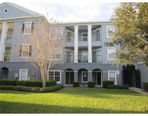 3589 Conroy Road, Unit 1013 Orlando, FL 32839 - Photo 1 of 1 front view of a brick house with a yard