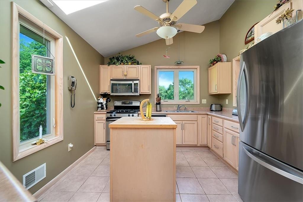 2106 Reis Run Road Pittsburgh, PA 15237 - Photo 23 of 42 a kitchen with stainless steel appliances a refrigerator sink and microwave