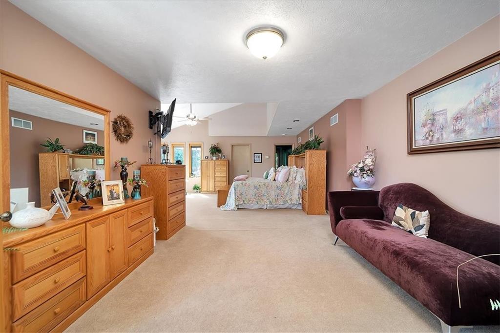 2106 Reis Run Road Pittsburgh, PA 15237 - Photo 27 of 42 a living room with furniture and a large mirror