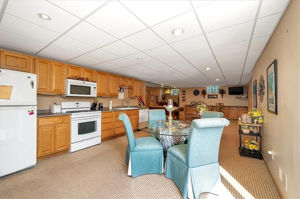 2106 Reis Run Road Pittsburgh, PA 15237 - Photo 37 of 42 a dining room with furniture and a kitchen view