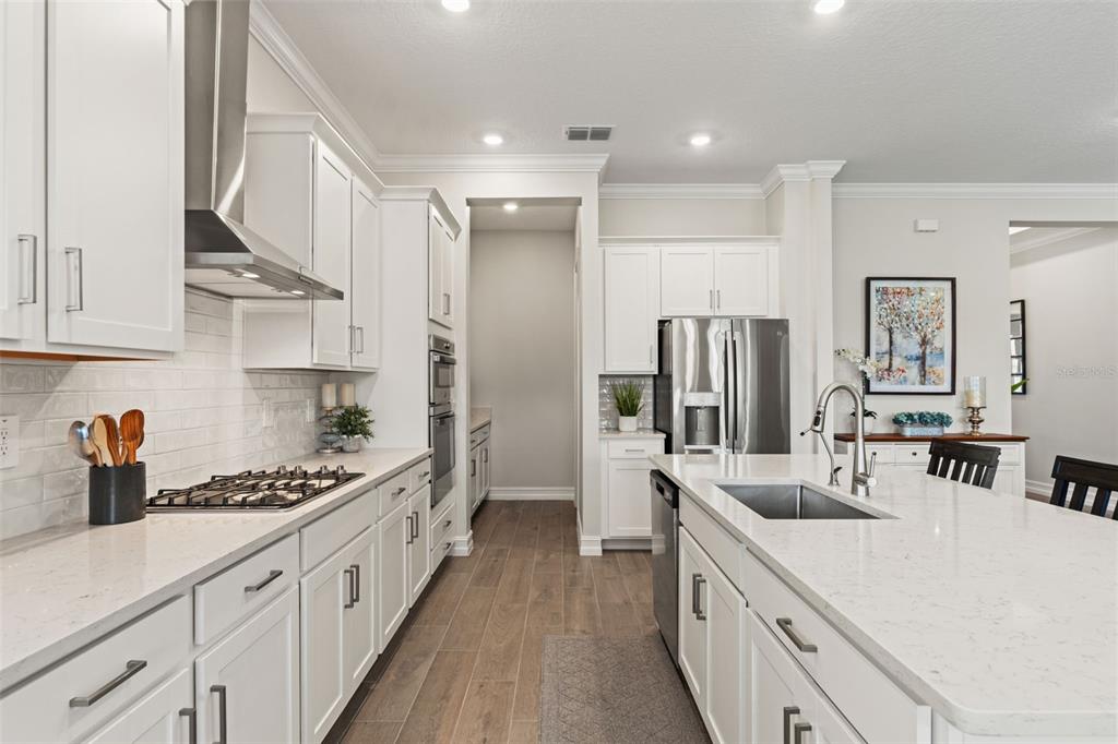 4661 Southern Valley Loop Brooksville, FL 34601 - Photo 13 of 62 a kitchen with stainless steel appliances a sink stove and refrigerator
