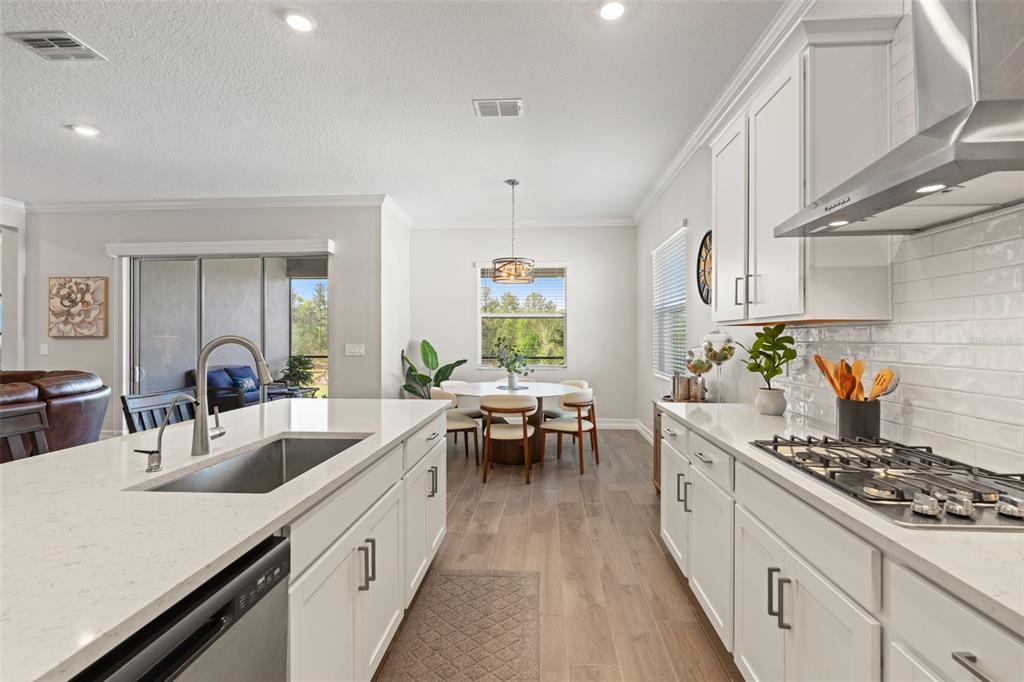 4661 Southern Valley Loop Brooksville, FL 34601 - Photo 14 of 62 a kitchen with sink stove and cabinets