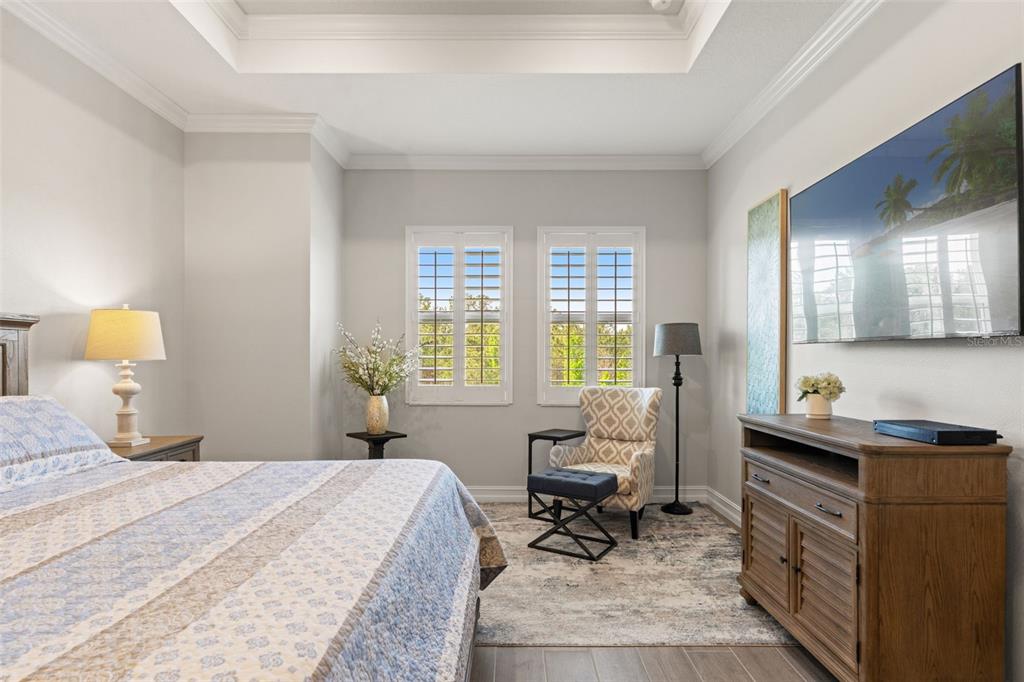 4661 Southern Valley Loop Brooksville, FL 34601 - Photo 19 of 62 a bedroom with a bed a table and chair