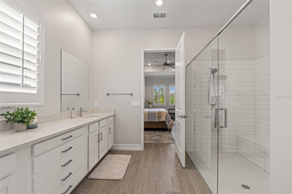 4661 Southern Valley Loop Brooksville, FL 34601 - Photo 21 of 62 a spacious bathroom with a shower sink and mirror