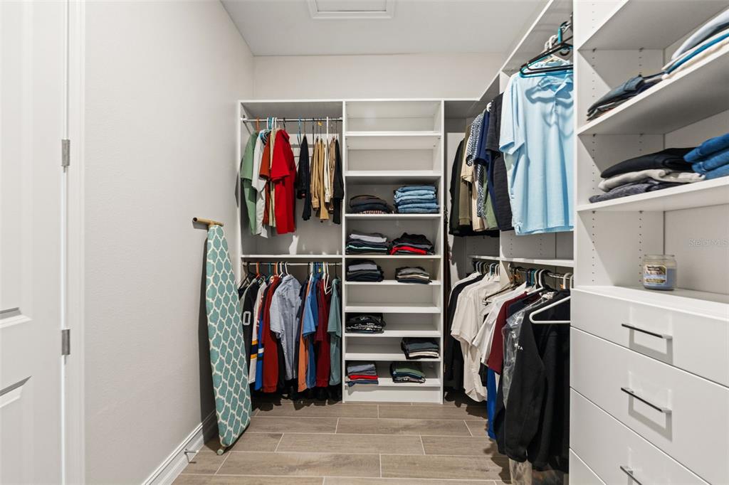 4661 Southern Valley Loop Brooksville, FL 34601 - Photo 24 of 62 a view of walk in closet with clothes and shoes