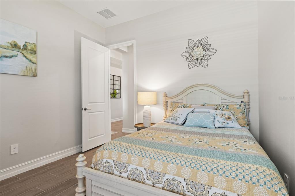 4661 Southern Valley Loop Brooksville, FL 34601 - Photo 27 of 62 a bedroom with a bed and a table