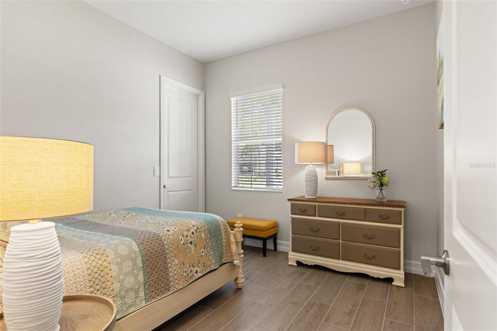 4661 Southern Valley Loop Brooksville, FL 34601 - Photo 28 of 62 a bedroom with a bed and a window