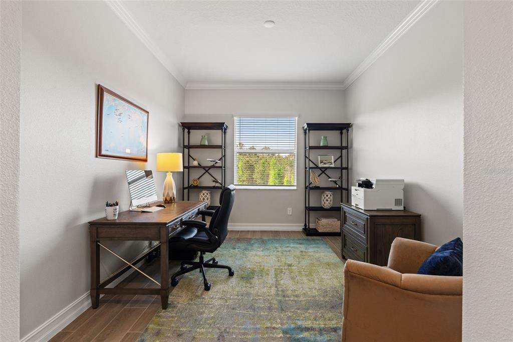 4661 Southern Valley Loop Brooksville, FL 34601 - Photo 30 of 62 a work room with furniture and musical instruments