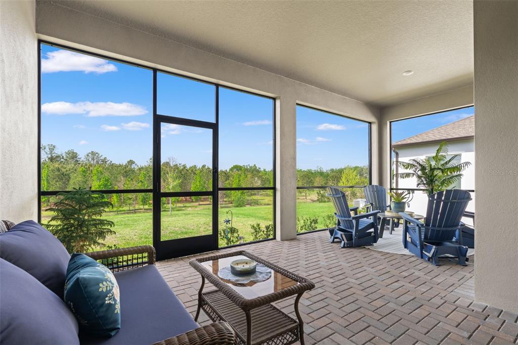 4661 Southern Valley Loop Brooksville, FL 34601 - Photo 3 of 62 a living room with couch and a floor to ceiling window