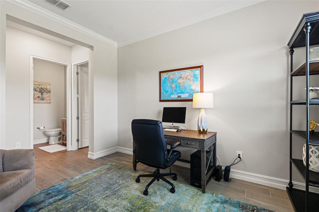 4661 Southern Valley Loop Brooksville, FL 34601 - Photo 31 of 62 a view of a workspace with furniture and a window
