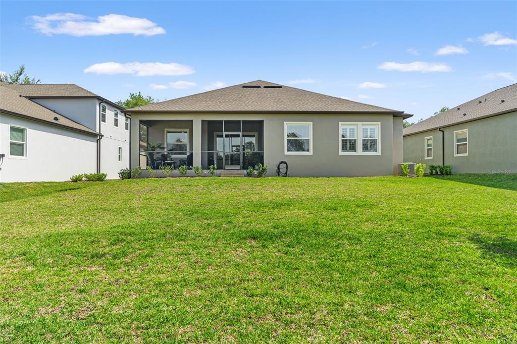 4661 Southern Valley Loop Brooksville, FL 34601 - Photo 37 of 62 a front view of a house with a yard and garage