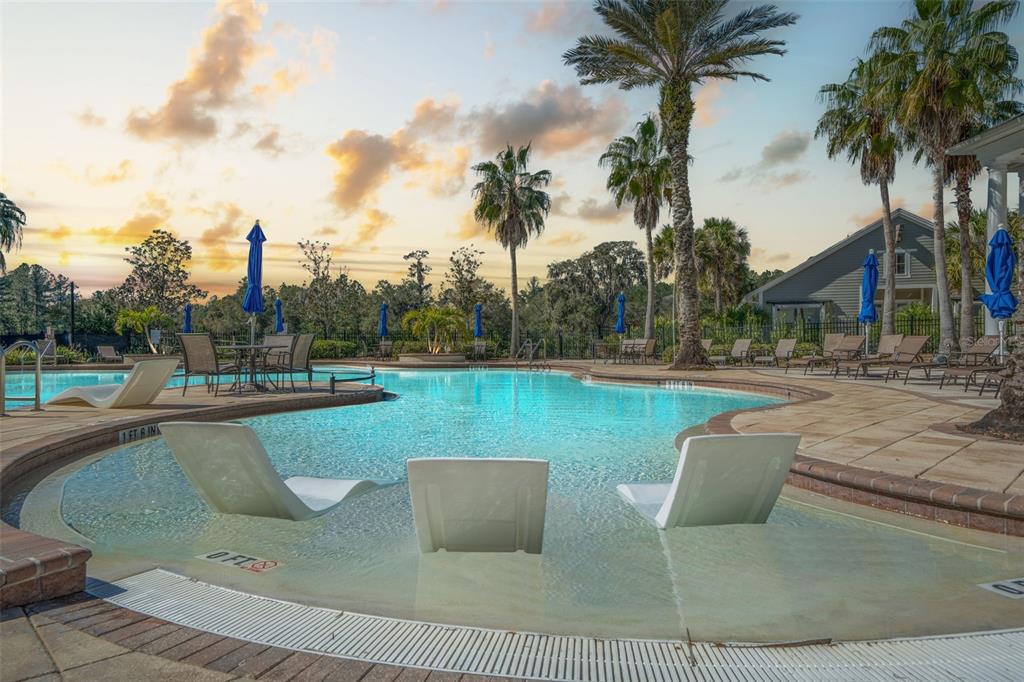 4661 Southern Valley Loop Brooksville, FL 34601 - Photo 47 of 62 a view of a swimming pool and lounge chair