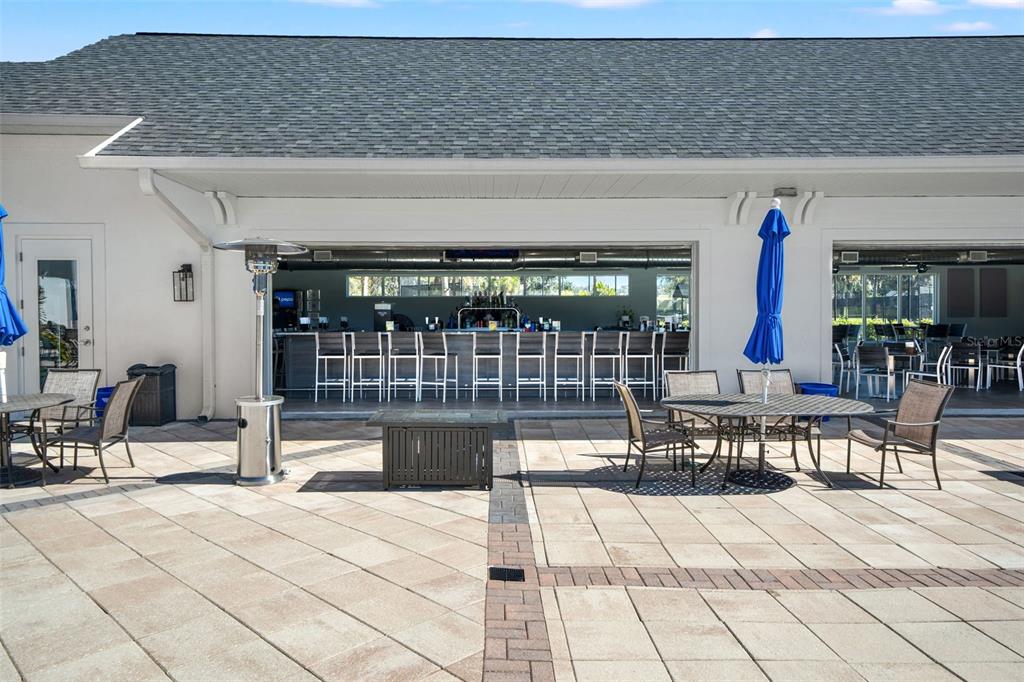 4661 Southern Valley Loop Brooksville, FL 34601 - Photo 49 of 62 a view of a swimming pool with outdoor seating
