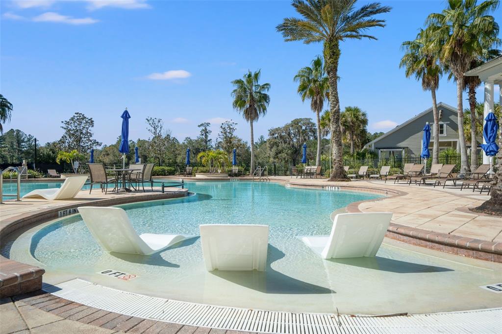 4661 Southern Valley Loop Brooksville, FL 34601 - Photo 50 of 62 a view of a swimming pool and lounge chairs