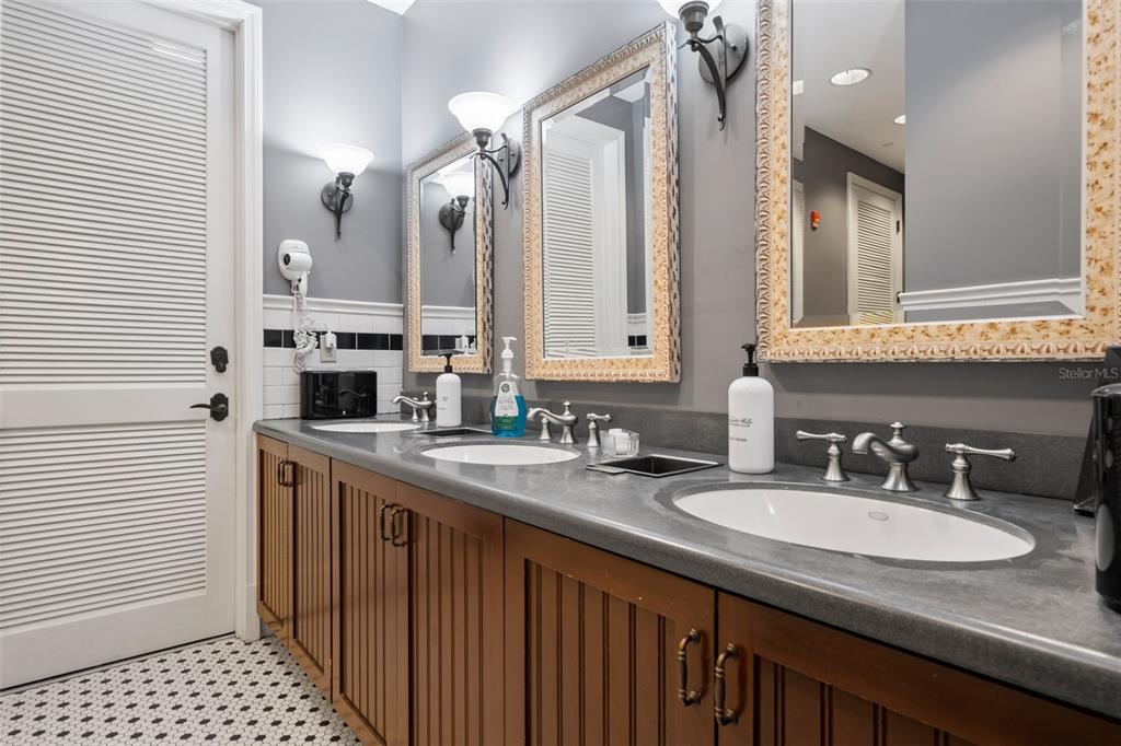4661 Southern Valley Loop Brooksville, FL 34601 - Photo 60 of 62 a bathroom with a sink double vanity and a shower